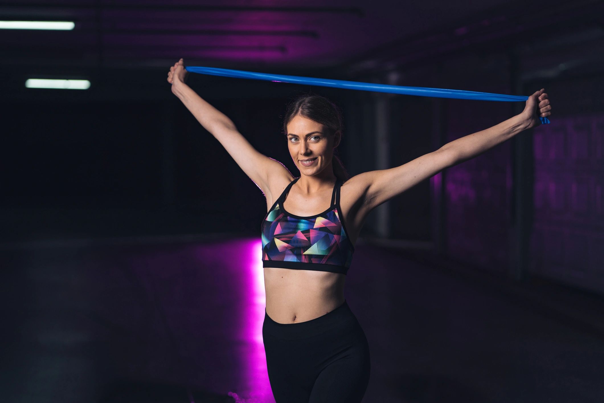 Sports woman exercising with resistance band